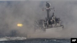 FILE- A South Korean navy patrol boat fires during an exercise off South Korea's southeastern coast near Busan, South Korea.