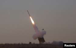 An Iron Dome launcher fires an interceptor rocket near the southern town of Sderot November 15, 2012.