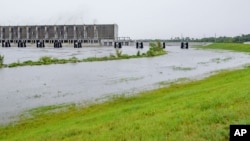 FILE - This Saturday, July 13, 2019, file photo shows the Gulf Intracoastal Waterway West Closure Complex, in Belle Chasse, La. 