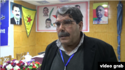 FILE - Salih Muslim, lead of the Syrian Kurdish opposition group Democratic Union Party (PYD), speaks to VOA’s Kurdish service in Hasakah, Syria, in the screen grab from Jan. 23, 2017.
