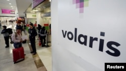 The logo of Mexican low-cost air carrier Volaris at Benito Juarez International Airport in Mexico City, Jan. 10, 2018. The airline is offering free flights to reunite families separated by President Trump's zero tolerance immigration policy.