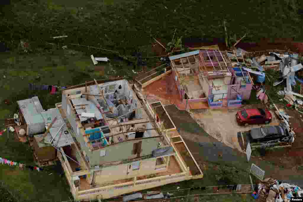A damaged home can be seen as recovery efforts continue following Hurricane Maria near the town of Comerio, Puerto Rico, Oct. 7, 2017.