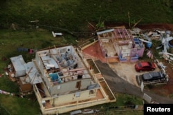 The contents of a damaged home can be seen as recovery efforts continue following Hurricane Maria near the town of Comerio, Puerto Rico, October 7, 2017.