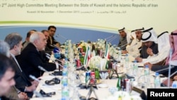 Iranian Foreign Minister Javad Zarif (4th L) attends a meeting for the 2nd Joint High Committee in Kuwait City, Kuwait, Dec. 1, 2013.