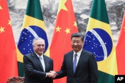 Chinese President Xi Jinping, right, shakes hands with Brazilian President Michel Temer during a signing ceremony at the Great Hall of the People in Beijing, China, Sept. 1, 2017. Temer met with Jinping on Friday ahead of next week's summit of BRICS nations in the southeastern Chinese city of Xiamen that also includes the leaders of Russia, India and South Africa.