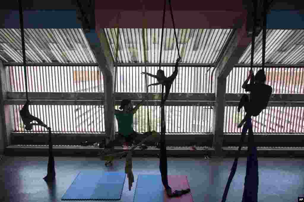 Members of the Multidisciplinary Circus Nuevo Karakara practice aerial acrobatics after the COVID-19 lockdown was eased in Caracas, Venezuela, April 27, 2021.