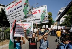 Aksi protes menentang kesepakatan Uni Emirat Arab dengan Israel untuk menormalisasi hubungan, di Kota Gaza, 19 Agustus 2020. (Foto oleh MOHAMMED ABED / AFP)