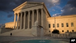 FILE - The Supreme Court building in Washington at sunset.