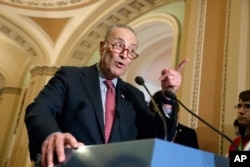 FILE - Senate Minority Leader Chuck Schumer, D-N.Y., speaks with reporters at the Capitol in Washington, March, 14, 2017. Schumer has vowed to fight a recess appointment, should the situation arise.