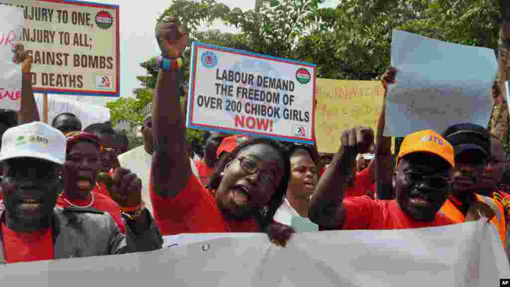 People attend a demonstration calling on the government to rescue the kidnapped school girls from the Chibok government secondary school, outside the defense headquarters in Abuja, May 6, 2014.