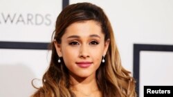 FILE - Singer Ariana Grande arrives at the 56th annual Grammy Awards in Los Angeles, California.