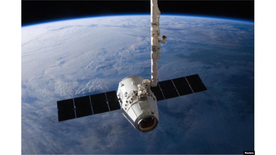 FILE - The SpaceX Dragon cargo capsule approaches the International Space Station prior to installation in this NASA picture taken April 10, 2016.