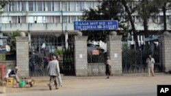 Pedestrians walk past the Federal High Court building in Addis Ababa