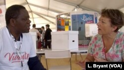 Congolese priest Mick Ngundu speaks to Veronique Couque in Caen, France. Their paths might never have crossed had it not been for Living Libraries.