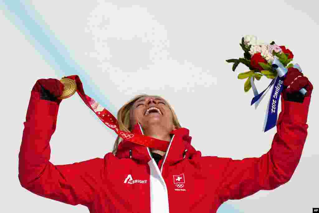 Lara Gut-Behrami of Switzerland celebrates during the medal ceremony after winning the gold medal in the women&#39;s super-G at the 2022 Winter Olympics, in the Yanqing district of Beijing. 