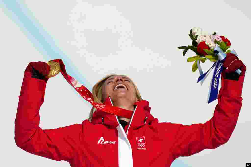Lara Gut-Behrami of Switzerland celebrates during the medal ceremony after winning the gold medal in the women's super-G at the 2022 Winter Olympics, in the Yanqing district of Beijing.