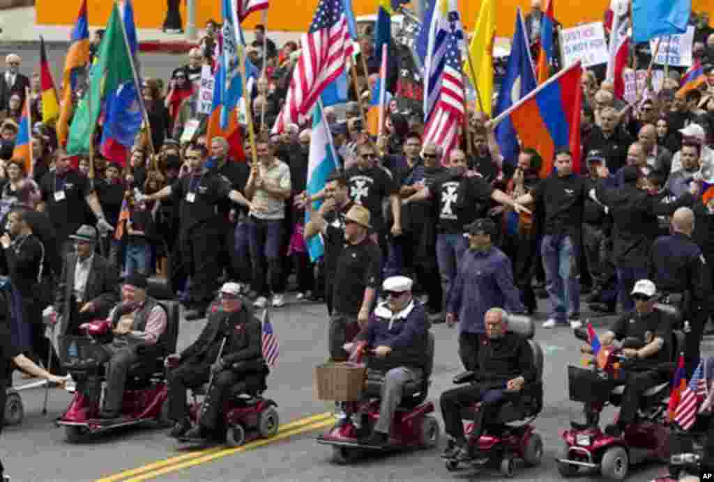 Thousands of demonstrators march to mark the death of 1.5 million Armenians in the former Ottoman empire, in Los Angeles Tuesday, April 24, 2012. The demonstration is an annual remembrance of the 1915 killings of Armenians in the Turkish territories durin