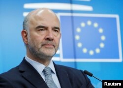 FILE - European Commissioner for Economic and Financial Affairs Pierre Moscovici attends a news conference in Brussels, Belgium, Dec. 4, 2018.