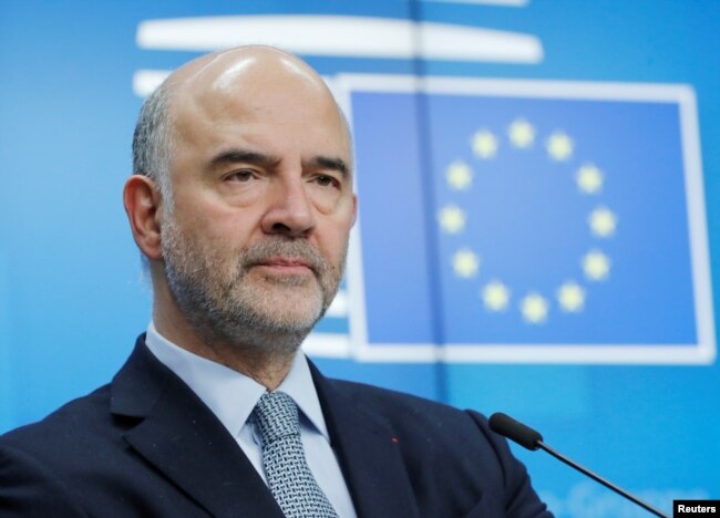 FILE - European Commissioner for Economic and Financial Affairs Pierre Moscovici attends a news conference in Brussels, Belgium, Dec. 4, 2018.