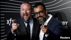 FILE - Vice Media co-founders Shane Smith, left, and Suroosh Alvi pose at the 20th Annual Webby Awards in Manhattan, New York, May 16, 2016.