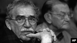 In this 2003 photo released by the Fundación Nuevo Periodismo Iberoamericano (FNPI), Colombian Nobel laureate Gabriel Garcia Marquez, left, is seen in Monterrey, Mexico. Behind is Colombian journalist Jose Salgar. Garcia Marquez died on Thursday, April 17