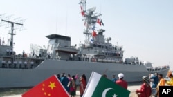 In this picture released by the Pakistan Navy, warships, including those from China, are welcomed at the Karachi dock to take part in the Multi-National Naval exercises 'AMAN 07' in Karachi, Pakistan (FILE).
