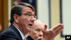 FILE - Defense Secretary Ash Carter, left, testifies before the House Armed Services Committee on Capitol Hill in Washington, June 17, 2015. 