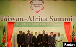 FILE - From left, the presidents of Malawi, Burkina Faso and Taiwan; the king of Swaziland; the president of Sao Tome and Principe; and the vice president of Gambia attend the opening ceremony of the first Taiwan-Africa Heads of State Summit in Taipei, Sept. 9, 2007. As of May 26, 2018, Swaziland alone in Africa has diplomatic ties with Taiwan.