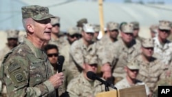 FILE - The commander of NATO and U.S. forces in Afghanistan, U.S. Army Gen. John W. Nicholson, speaks at Task Force Southwest atn Shorab military camp of Helmand province, Afghanistan, Jan. 15, 2018.