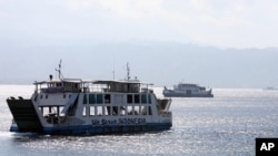 Ferry boats cross Bali Strait to carry Indonesians to Ketapang port, East Java, from Gilimanuk port, West Bali, Indonesia (File Photo - August 27, 2011).
