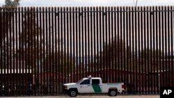 A U.S. Customs and Border Protection vehicle sits near the wall as President Donald Trump visits a new section of the border wall with Mexico in Calexico, Calif., April 5, 2019.