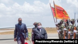 Paul Kagame, Presidente do Ruanda (esq) e Filipe Nyusi, Presidente de Moçambique (dir)