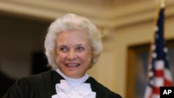 FILE - U.S. Supreme Court Justice Sandra Day O'Connor is shown before administering the oath of office to members of the Texas Supreme Court in Austin, Texas, Jan. 6, 2003.