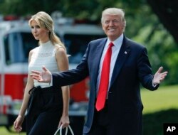 President Donald Trump smiles as he walks with his daughter Ivanka Trump across the South Lawn of the White House in Washington before boarding Marine One helicopter for the trip to nearby Andrews Air Force Base, June 13, 2017.