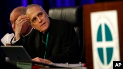 Cardinal Daniel DiNardo of the Archdiocese of Galveston-Houston, president of the United States Conference of Catholic Bishops, prepares to lead the USCCB's annual fall meeting, Nov. 12, 2018, in Baltimore, Maryland. 