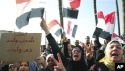 Egyptian anti-Mubarak protesters shout slogans as they march in Alexandria, Egypt, Feb 8, 2011