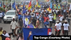FILE - Protesters, bearing the flags of opposition parties, demonstrate against President Joseph Kabila remaining in power if the presidential election is not held before the end 2016, in Kinshasa, May 26, 2016.