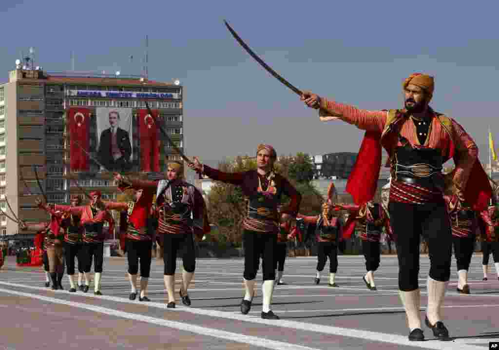 The Seymens, representing Ankara local militia who welcomed Mustafa Kemal Atuturk in Ankara in 1919 as Atuturk arrived to organize the the Independence war that led to the foundation of Turkish republic, march during the celebrations for the 90th anniversary of republic in Ankara, Turkey.