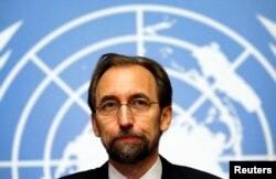 FILE - Jordan's Prince Zeid Ra'ad al-Hussein, U.N. High Commissioner for Human Rights, pauses during a news conference at the United Nations European headquarters in Geneva, Oct. 16, 2014.