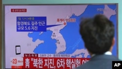 A man watches a TV news report about a possible nuclear test conducted by North Korea at the Seoul Railway station in Seoul, South Korea, Sept. 3, 2017. 