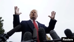 FILE - U.S. President Donald Trump talks to reporters from the South Lawn of the White House in Washington, Nov. 9, 2018.