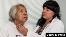 In this photo, an unidentified Indian Health Service physician checks a patient's thyroid. Native Americans suffer a higher mortality rate from cancer than other population groups. Early screening, say experts, is key to survival. Courtesy: HHS-IHS