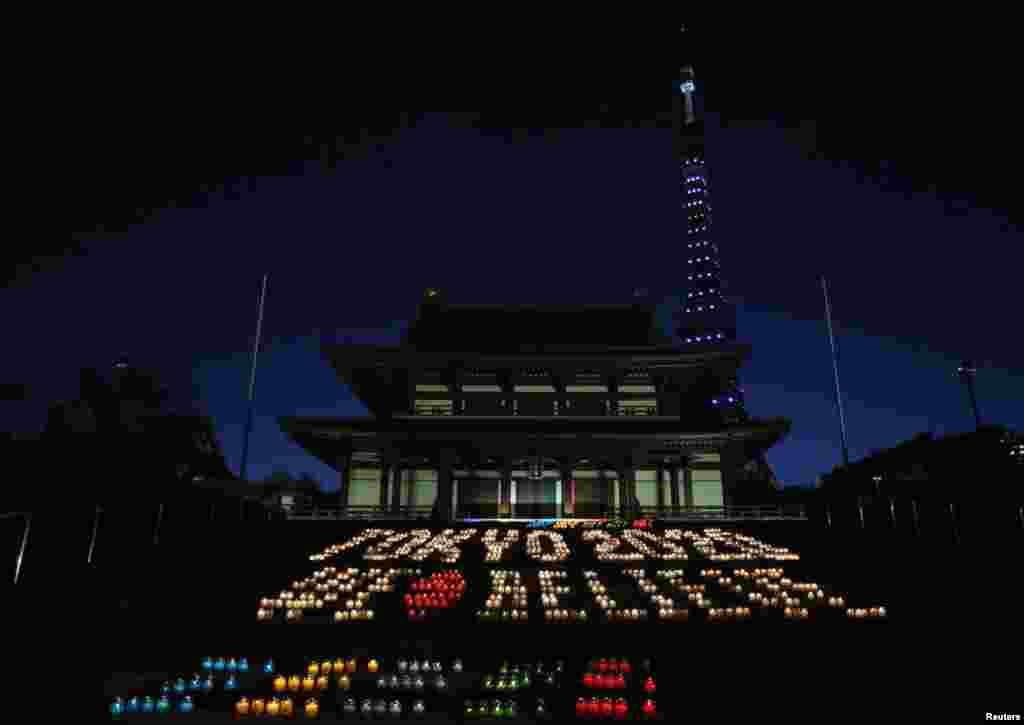 A message reading &quot;Tokyo 2020 We Believe&quot;, made up of 2,020 candles, is displayed at Zojoji temple in Tokyo, Japan. Organizers of the event hope the International Olympic Committee (IOC) will choose Tokyo at the IOC meeting in Buenos Aires in Argentina Sept. 7, as the host city for the 2020 Olympic and Paralympic Games .