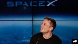 FILE- Elon Musk, founder, CEO, and lead designer of SpaceX, speaks at a news conference after the Falcon 9 SpaceX heavy rocket launched successfully from the Kennedy Space Center in Cape Canaveral, Florida on Feb. 6, 2018.