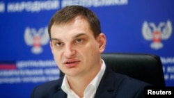Roman Lyagin, head of the electoral commission of the self-proclaimed Donetsk People's Republic, speaks during a news conference in Donetsk, eastern Ukraine, Oct. 28, 2014. 
