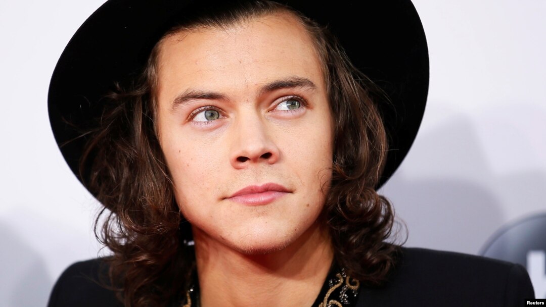 FILE - Harry Styles of One Direction arrives at the 42nd American Music Awards in Los Angeles, California.