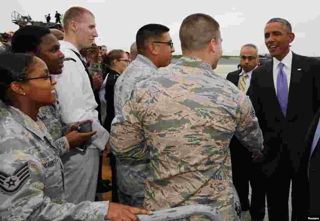 President Barack Obama shakes hands with servicemembers after he arrives at MacDill Air Force Base in Tampa, Florida, Sept. 16, 2014. 