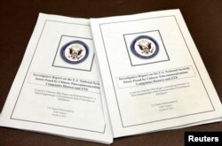 U.S. House Intelligence Committee's report on "national security threats posed by Chinese telecommunications companies Huawei and ZTE" is seen at a news conference on Capitol Hill in Washington, Oct. 8, 2012.