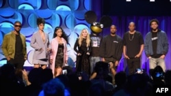 (L-R) Usher, Rihanna, Nicki Minaj, Madonna, Deadmau5, Kanye West, JAY Z, and J. Cole onstage at the Tidal launch event #TIDALforALL at Skylight at Moynihan Station on March 30, 2015, in New York City. 