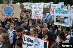 Students are seen during the global school strike for action on climate change outside New Zealand's parliament in Wellington, New Zealand, March 15, 2019.